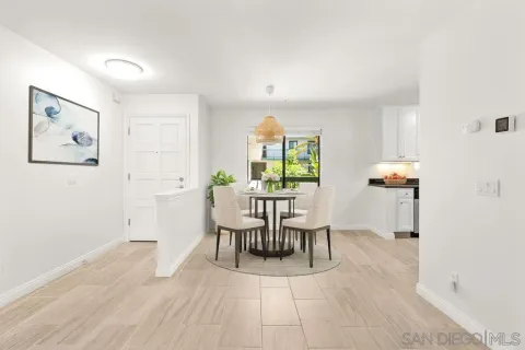 a dining room with furniture and window