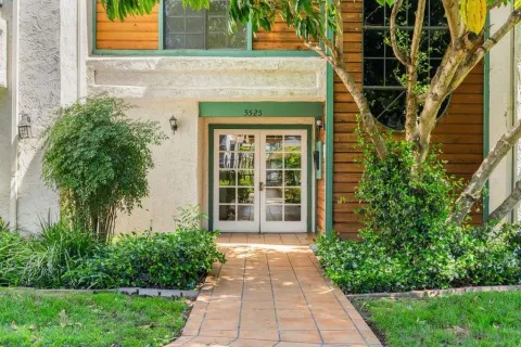 a front view of a house with a garden