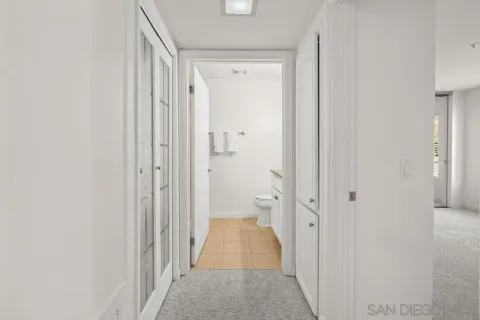 a view of a bathroom from a hallway