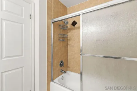 a bathroom with a shower and a tub
