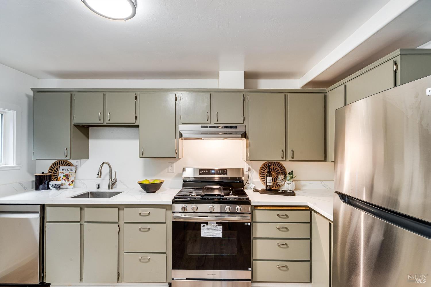 15300 Canyon 3 Road Guerneville, CA 95446 - Photo 19 of 37 a kitchen with a stove and a refrigerator