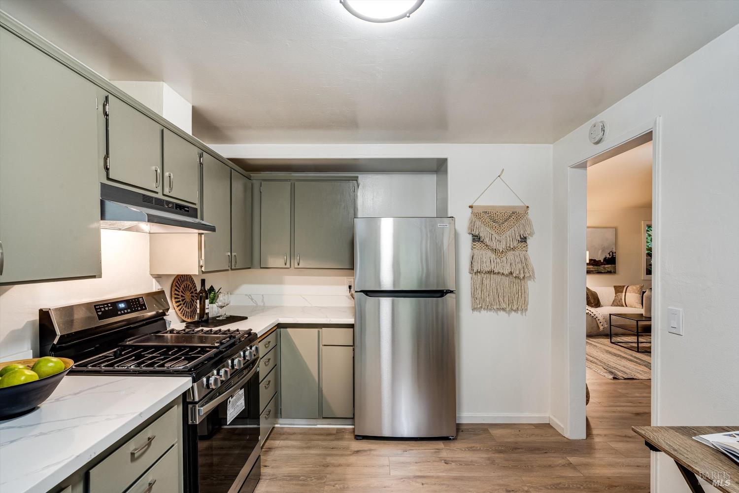 15300 Canyon 3 Road Guerneville, CA 95446 - Photo 21 of 37 a kitchen with a refrigerator and a stove top oven
