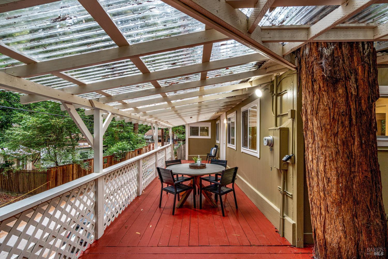 15300 Canyon 3 Road Guerneville, CA 95446 - Photo 26 of 37 a view of a porch with furniture and wooden floor