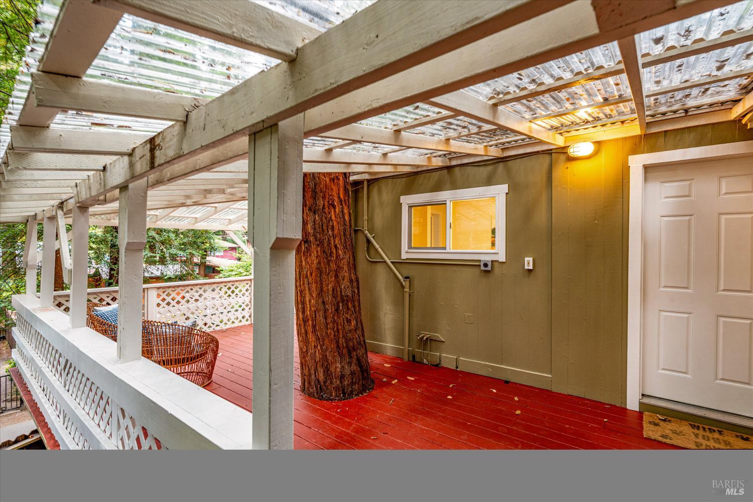 15300 Canyon 3 Road Guerneville, CA 95446 - Photo 28 of 37 a view of a porch with a table and chairs