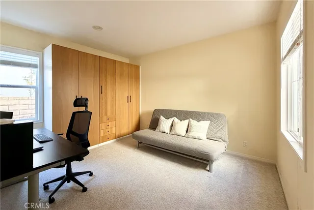 a bed room with a bed and a window