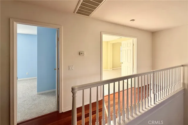 a view of staircase with wooden floor