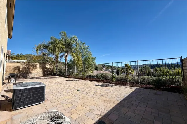 a view of swimming pool with outdoor seating and plants