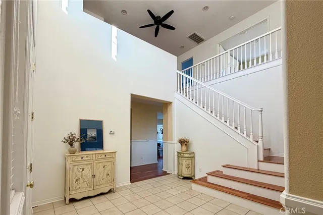 a view of entryway and hall with a workspace