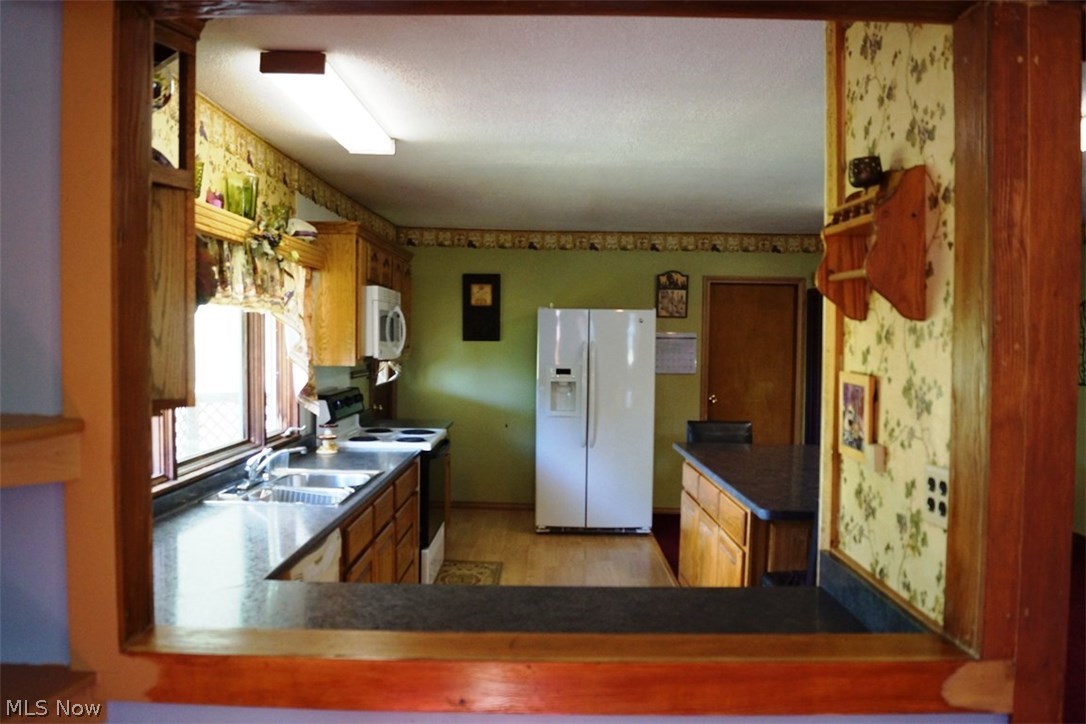 90440 Kilgore Ridge Road Scio, OH 43988 - Photo 2 of 6 PEAK THROUGH WINDOW, BAR , BUFFET