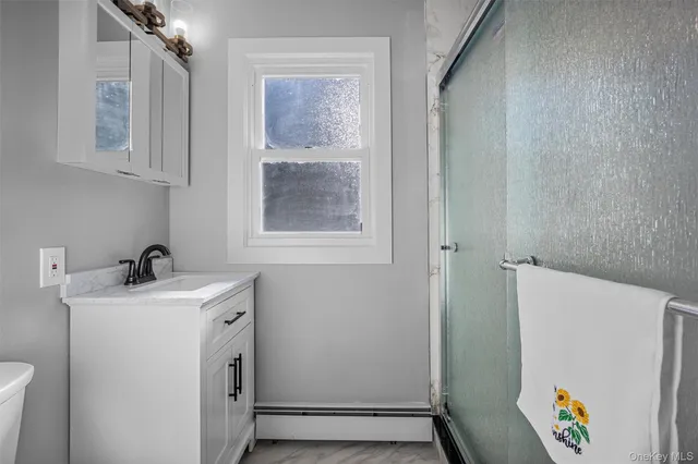 a bathroom with a shower and toilet