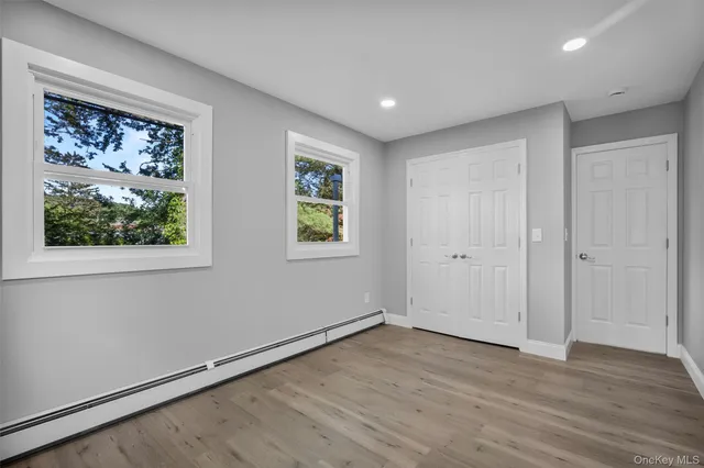 a view of room with wooden floor and window