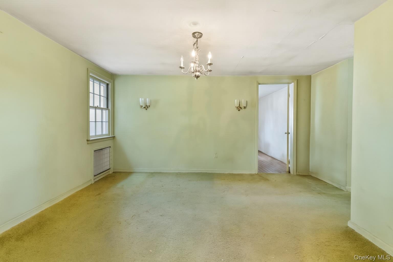 87 Rockledge Road Bronxville, NY 10708 - Photo 5 of 14 an empty room with windows and cabinet