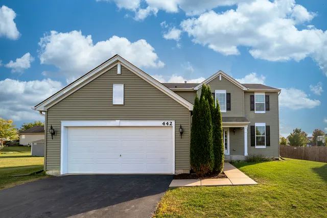 a view of backyard of house with wooden floor and fence