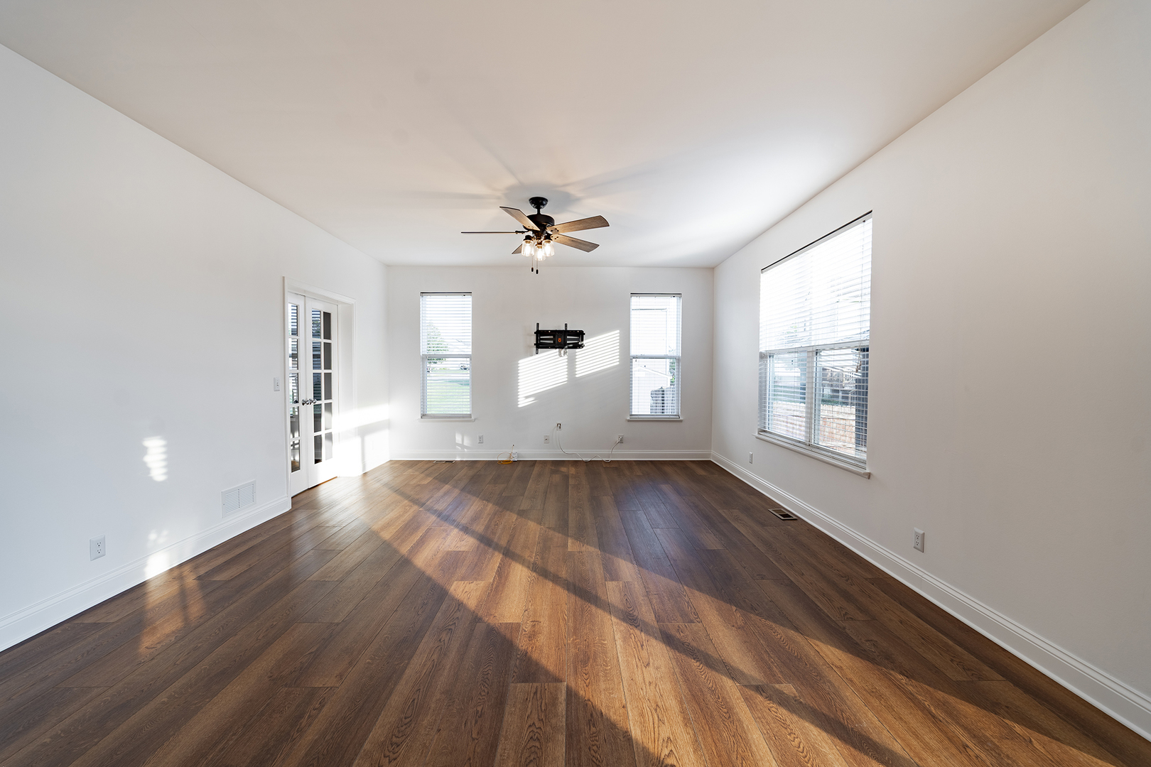 442 Windett Ridge Road Yorkville, IL 60560 - Photo 12 of 26 wooden floor in an empty room with a window