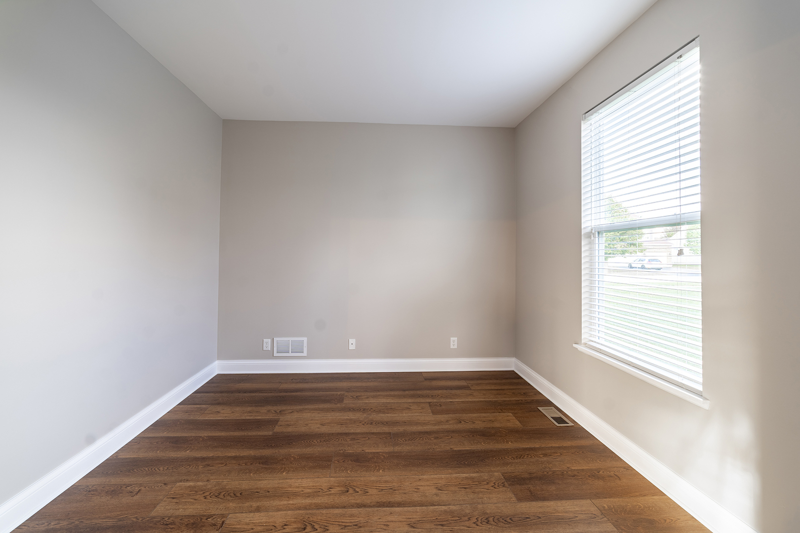 442 Windett Ridge Road Yorkville, IL 60560 - Photo 13 of 26 a view of an empty room with wooden floor and a window