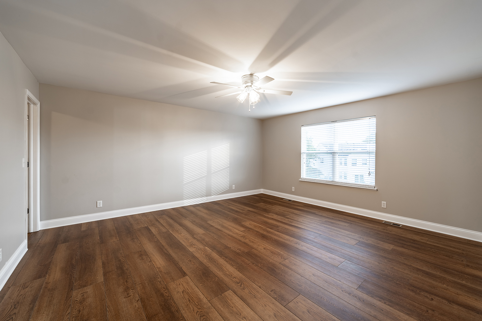 442 Windett Ridge Road Yorkville, IL 60560 - Photo 15 of 26 an empty room with wooden floor and windows