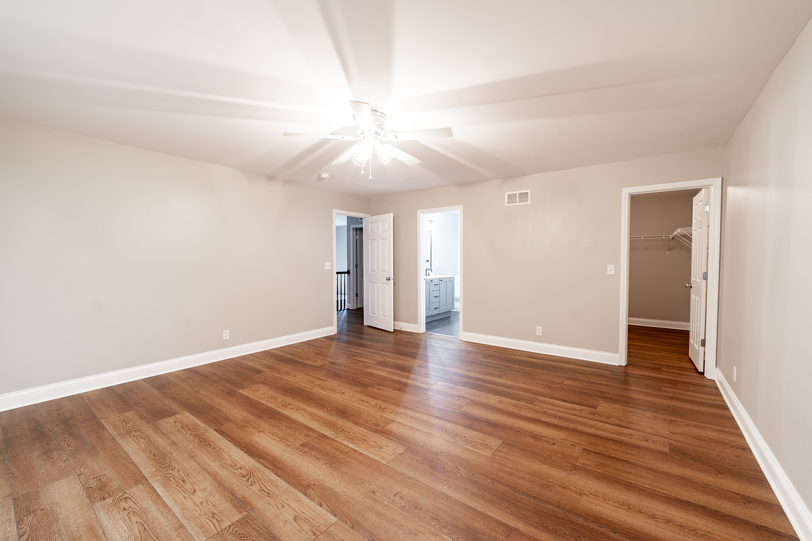 442 Windett Ridge Road Yorkville, IL 60560 - Photo 17 of 26 an empty room with wooden floor and a ceiling fan