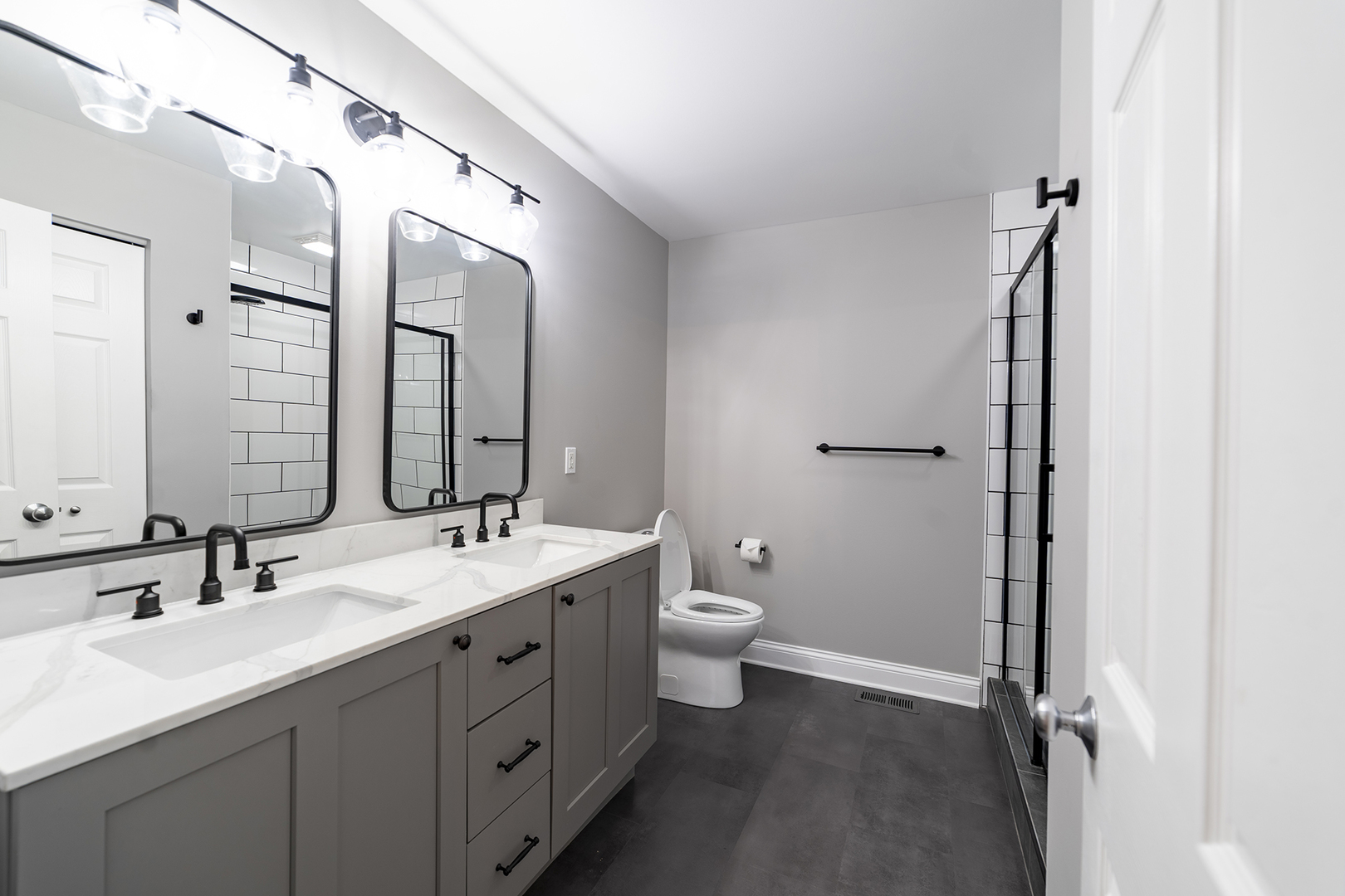 442 Windett Ridge Road Yorkville, IL 60560 - Photo 19 of 26 a bathroom with a double vanity sink toilet and mirror