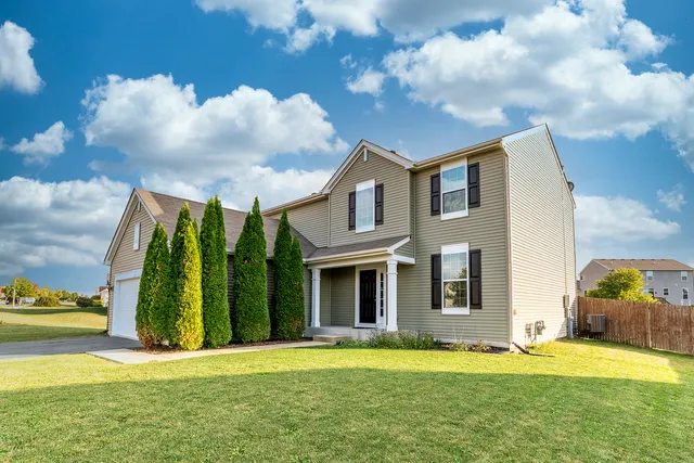 a view of a house with a garden
