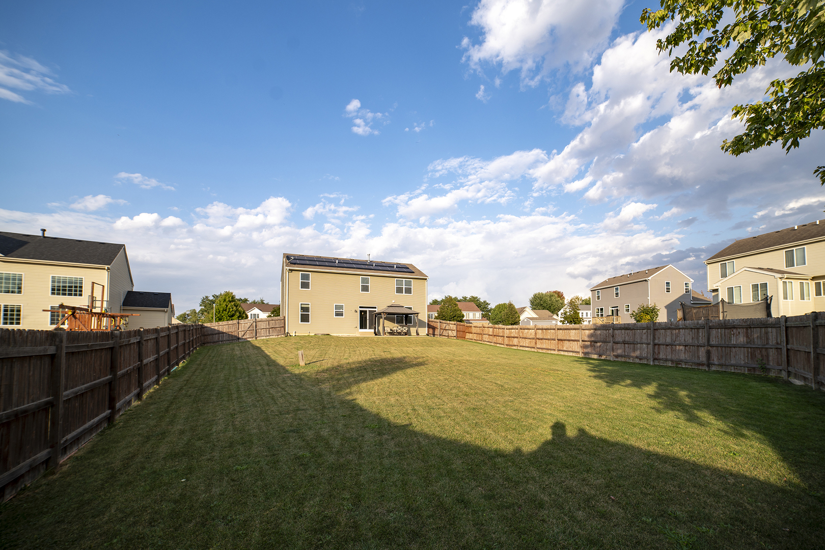 442 Windett Ridge Road Yorkville, IL 60560 - Photo 3 of 26 a view of a city with lawn chairs and a large tree