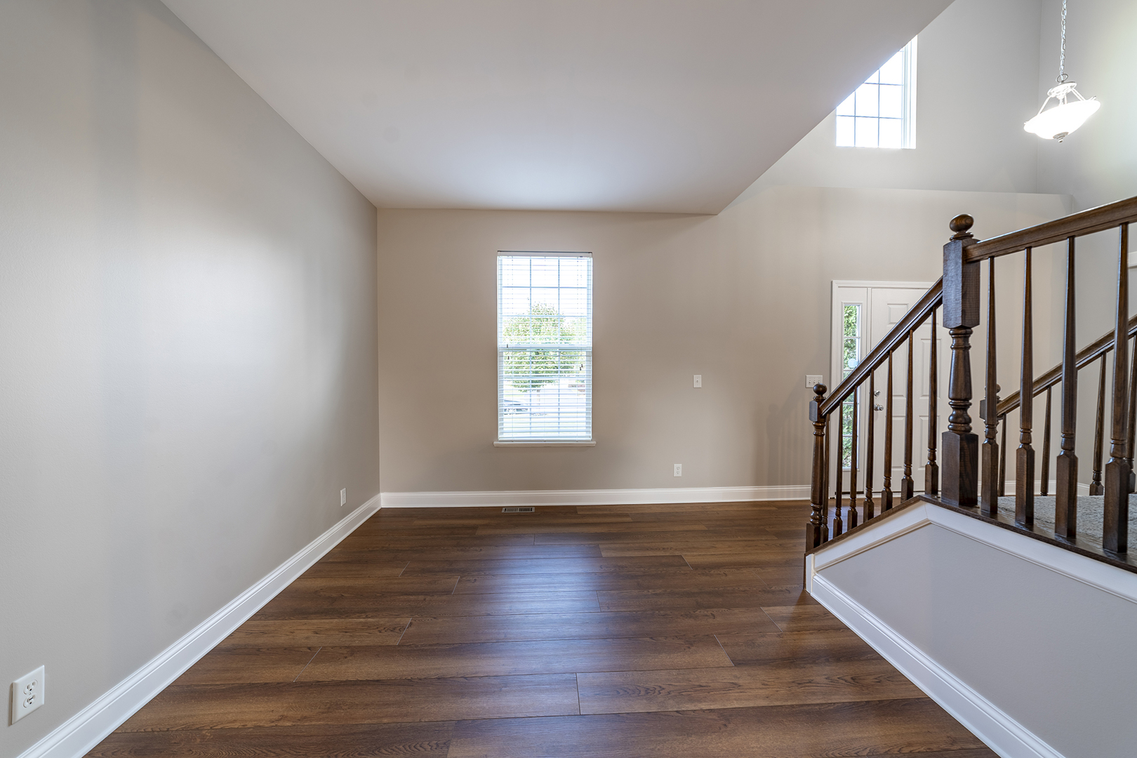 442 Windett Ridge Road Yorkville, IL 60560 - Photo 6 of 26 a view of an empty room with wooden floor and a window