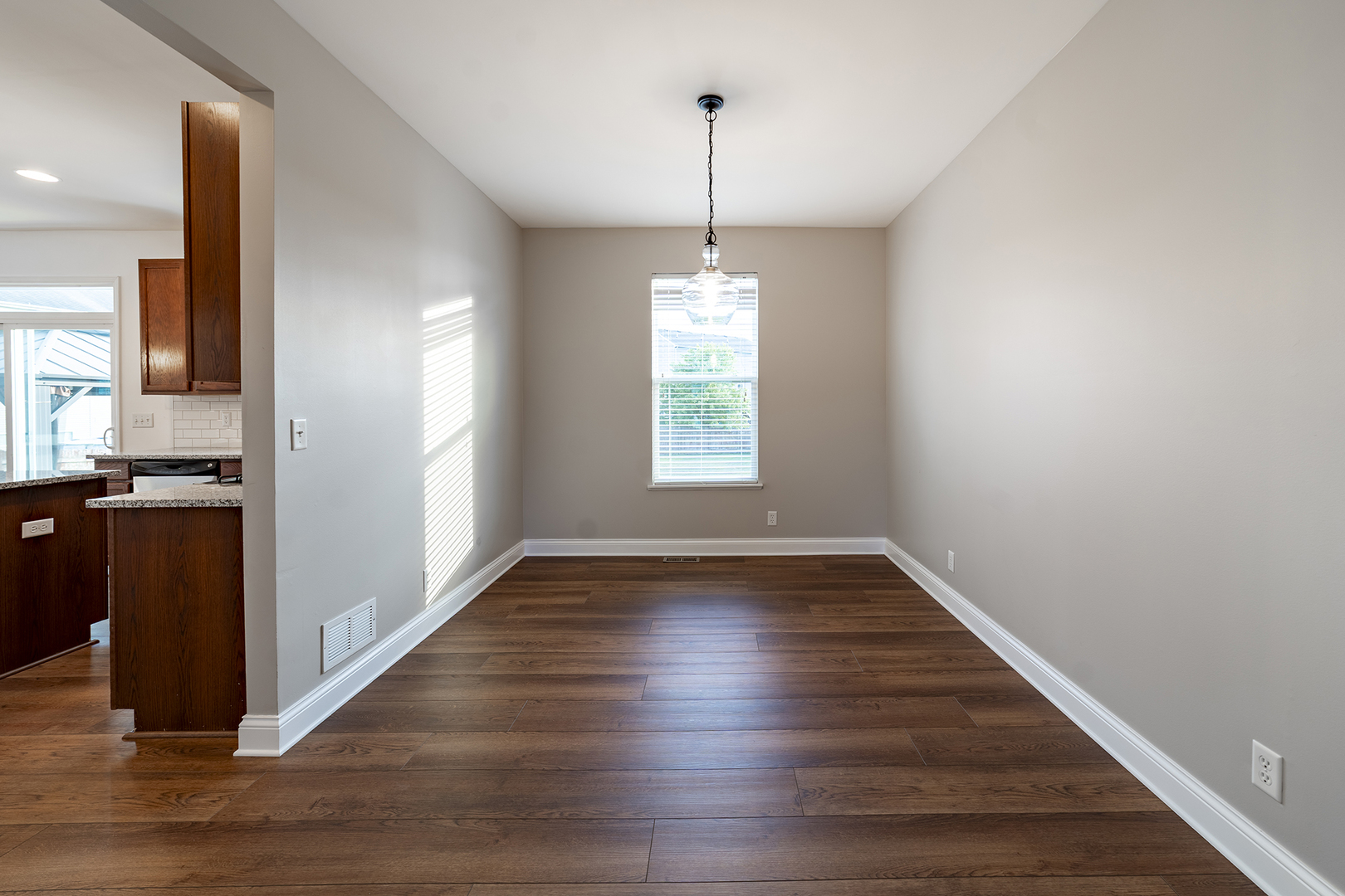 442 Windett Ridge Road Yorkville, IL 60560 - Photo 8 of 26 a view of an empty room with window and wooden floor