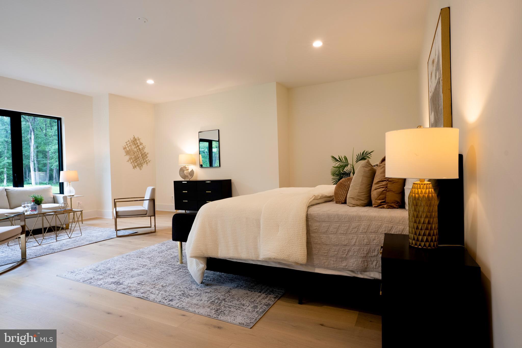 5947 Doyle Road Clifton, VA 20124 - Photo 26 of 69 a bedroom with a bed and wooden floor