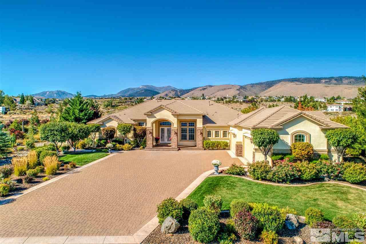 855 Peacepipe Loop Reno, NV 89511 - Photo 1 of 1 a front view of a house with a garden
