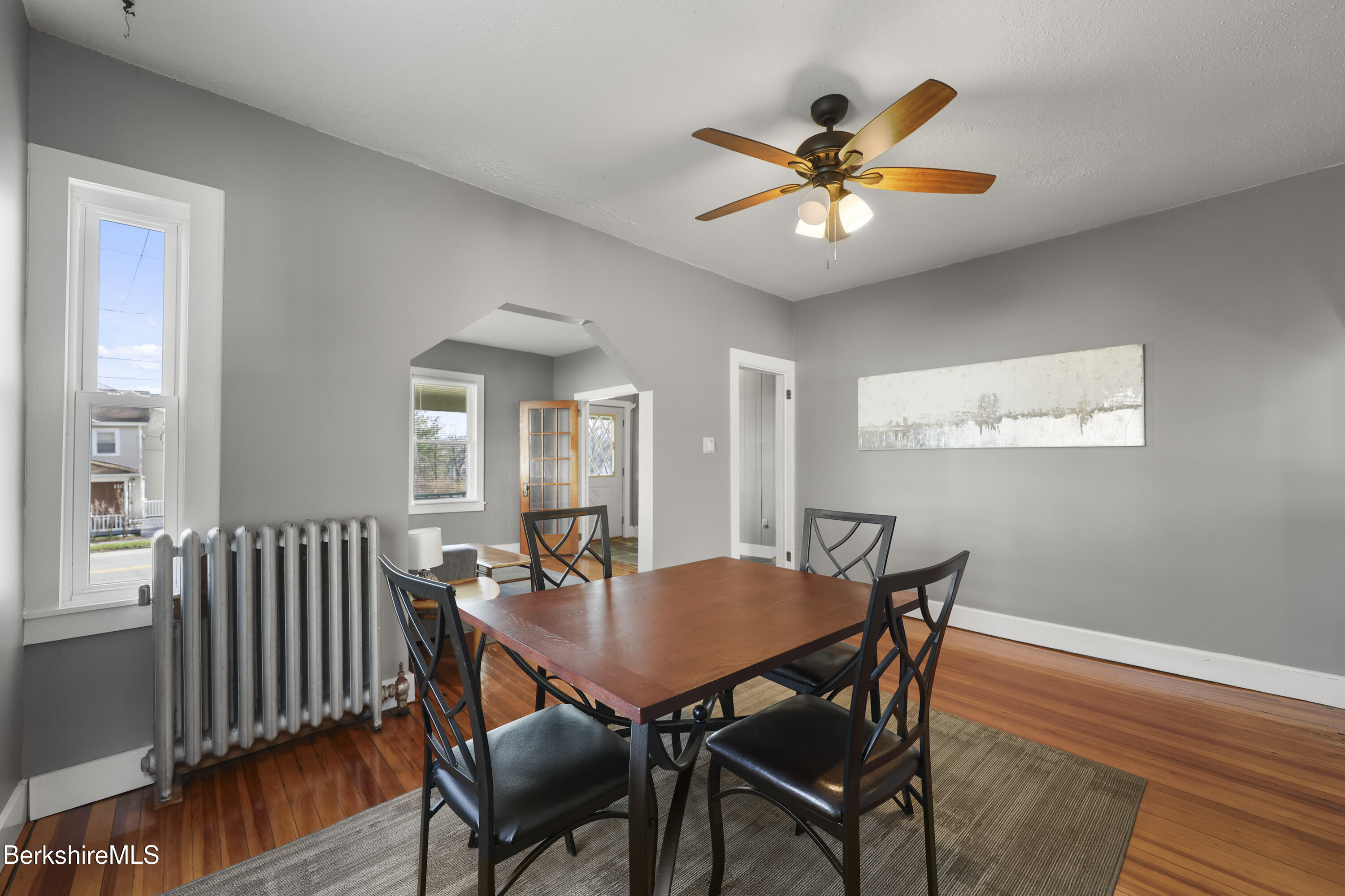 105-107 Onota Street Pittsfield, MA 01201 - Photo 11 of 46 a dining room with furniture wooden floor and a chandelier