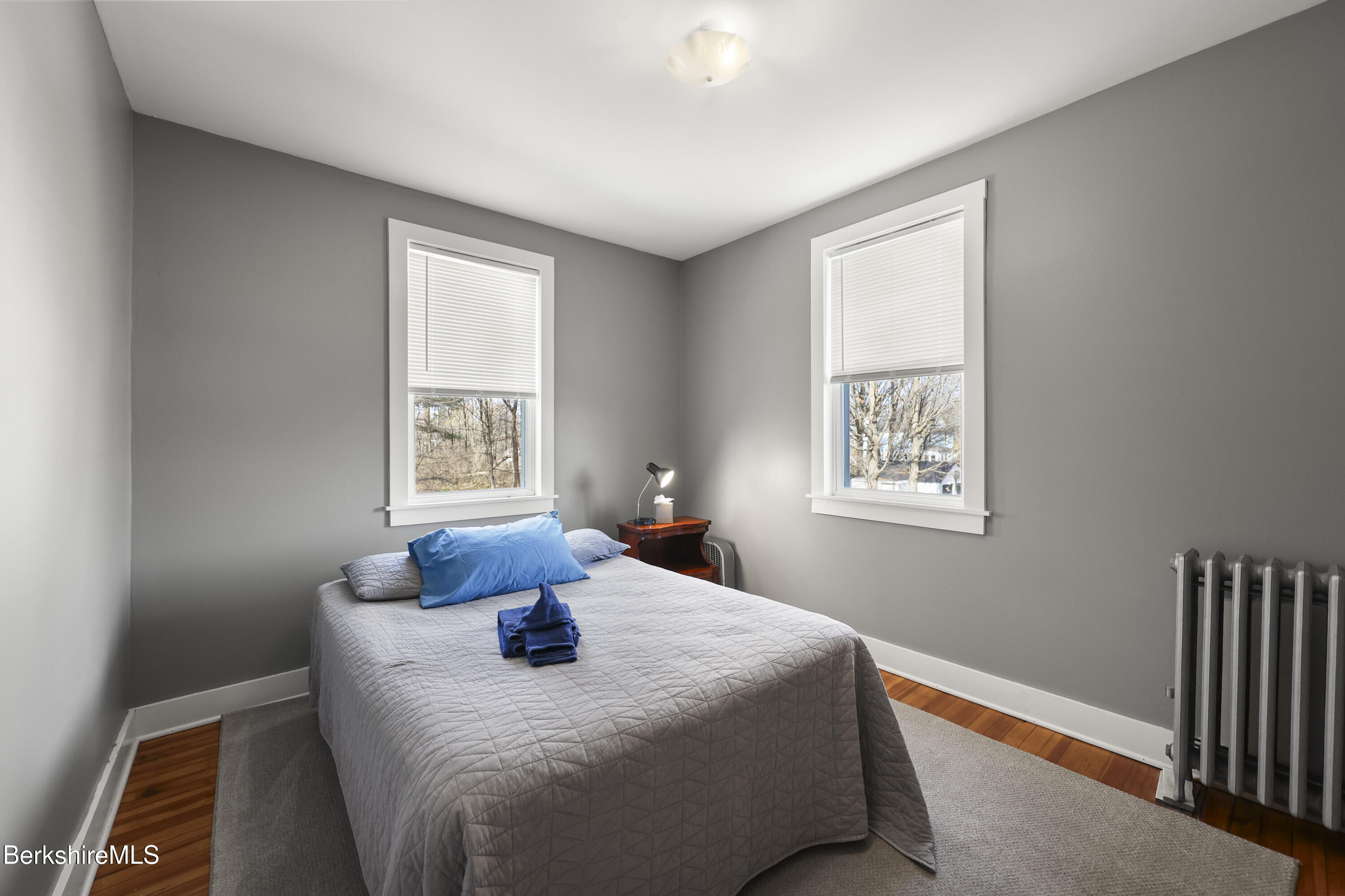 105-107 Onota Street Pittsfield, MA 01201 - Photo 20 of 46 a bedroom with a bed and a window