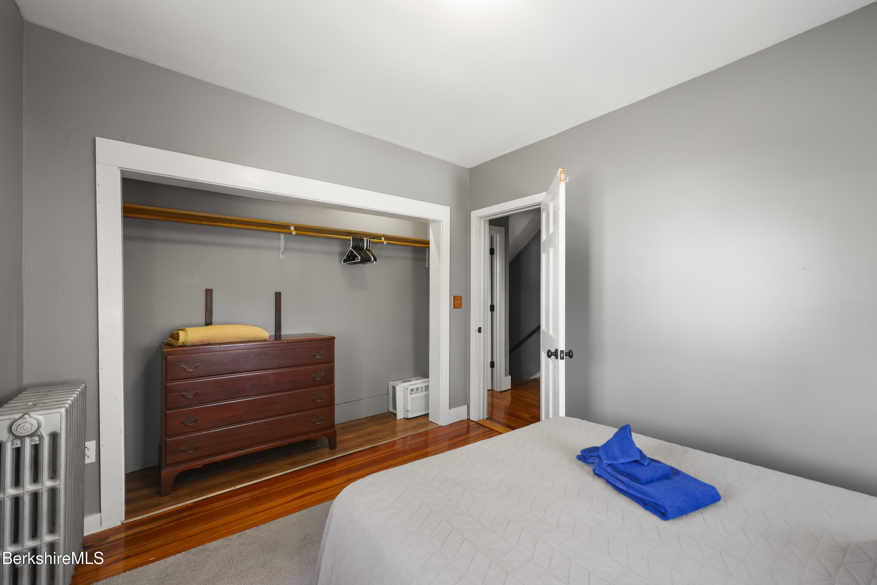 105-107 Onota Street Pittsfield, MA 01201 - Photo 21 of 46 a bedroom with a bed and a dresser