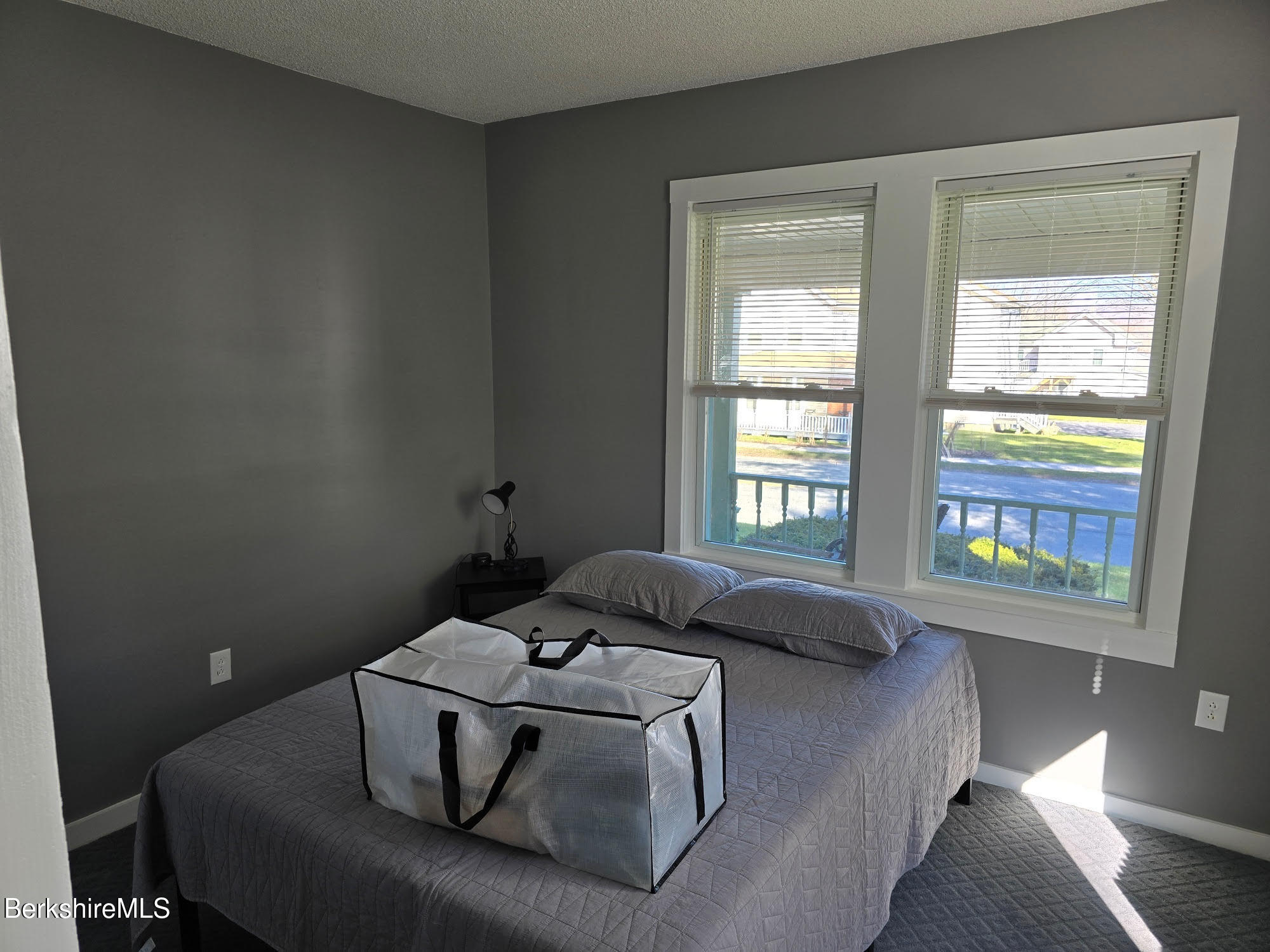 105-107 Onota Street Pittsfield, MA 01201 - Photo 23 of 46 a bedroom with a bed and window