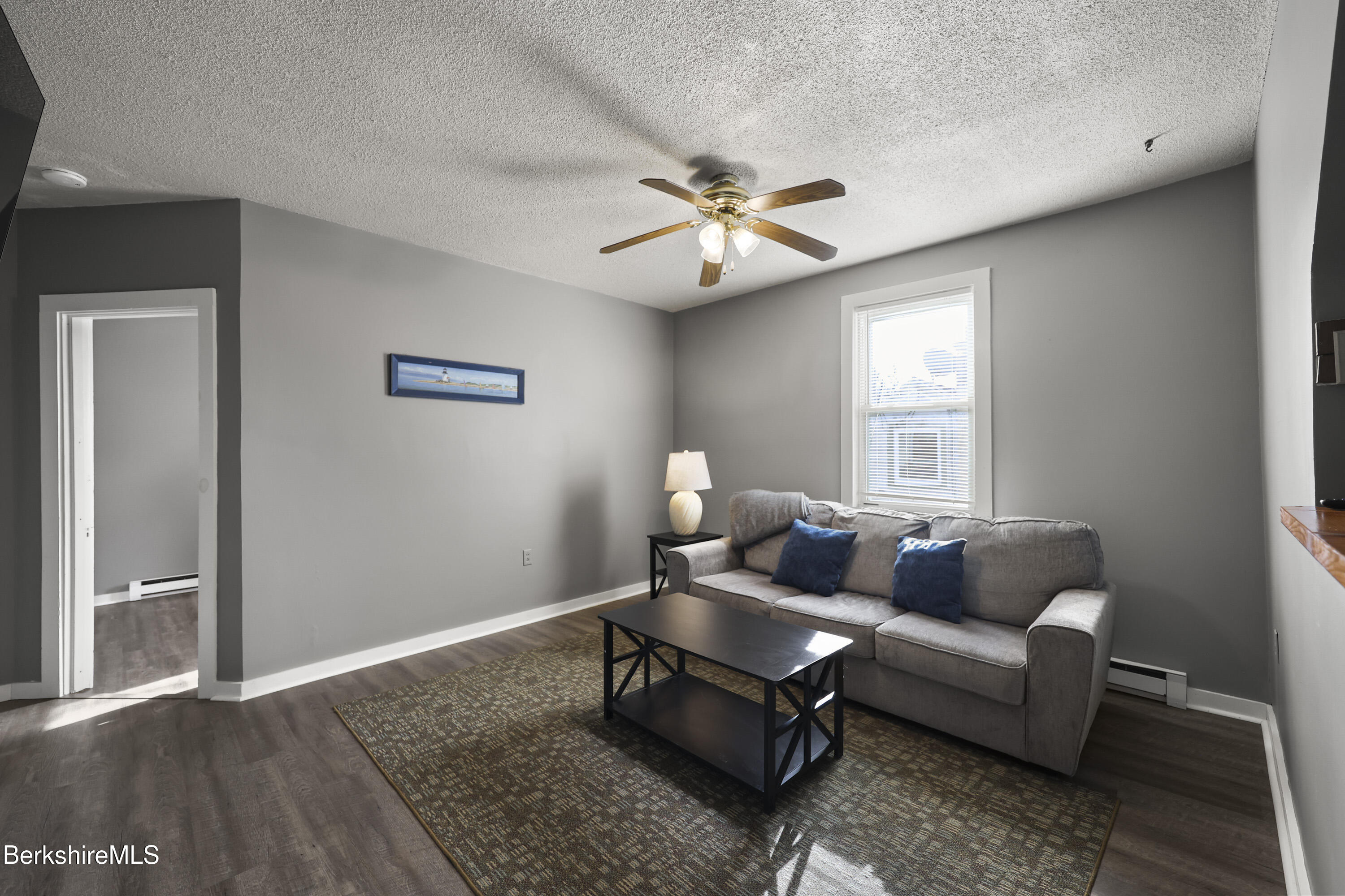 105-107 Onota Street Pittsfield, MA 01201 - Photo 24 of 46 a living room with furniture and a window