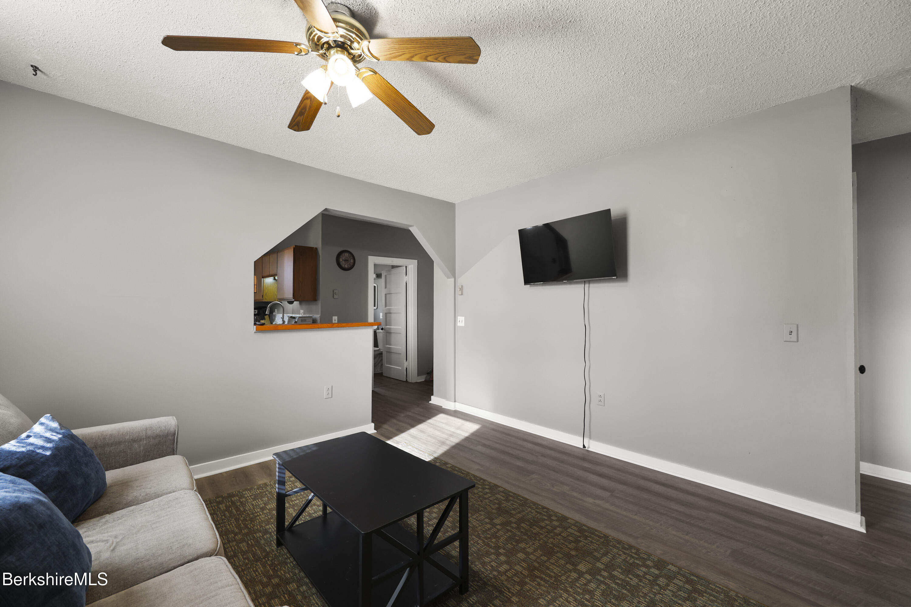 105-107 Onota Street Pittsfield, MA 01201 - Photo 28 of 46 a workspace room with furniture and a flat screen tv