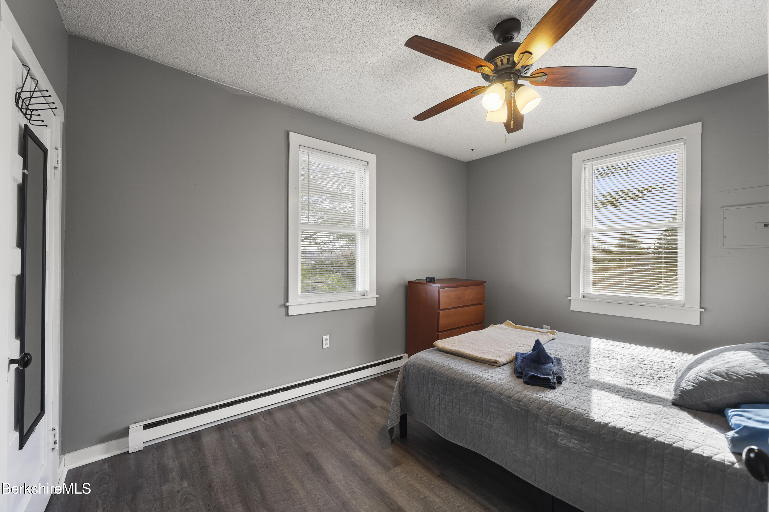 105-107 Onota Street Pittsfield, MA 01201 - Photo 34 of 46 a bedroom with a bed and a window