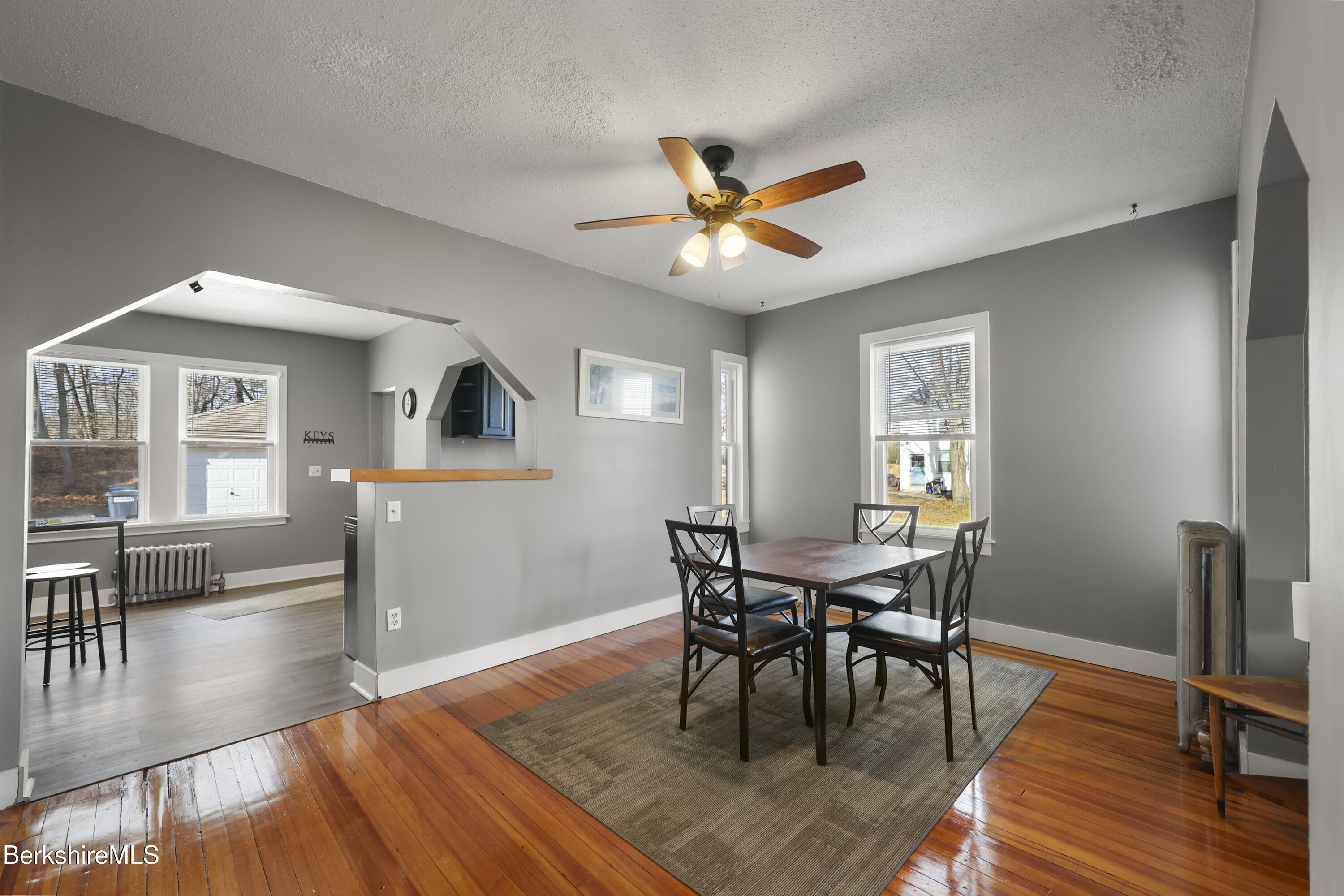 105-107 Onota Street Pittsfield, MA 01201 - Photo 8 of 46 a view of a dining room with furniture and wooden floor
