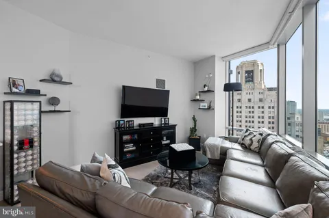 a living room with furniture and a flat screen tv