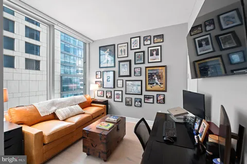 a living room with furniture workspace and a window