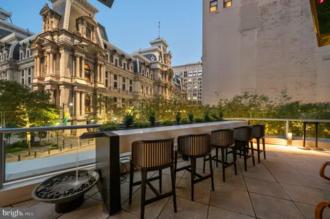 a view of a chairs and table in patio