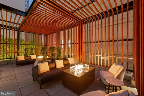a outdoor space with lots of tables a chair and the view of the kitchen