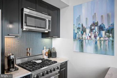 a kitchen with a stove and a microwave