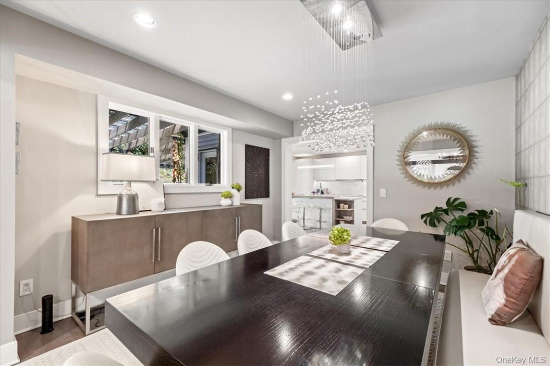 1570 Journeys End Road Croton-on-Hudson, NY 10520 - Photo 15 of 50 a living room with furniture and a chandelier