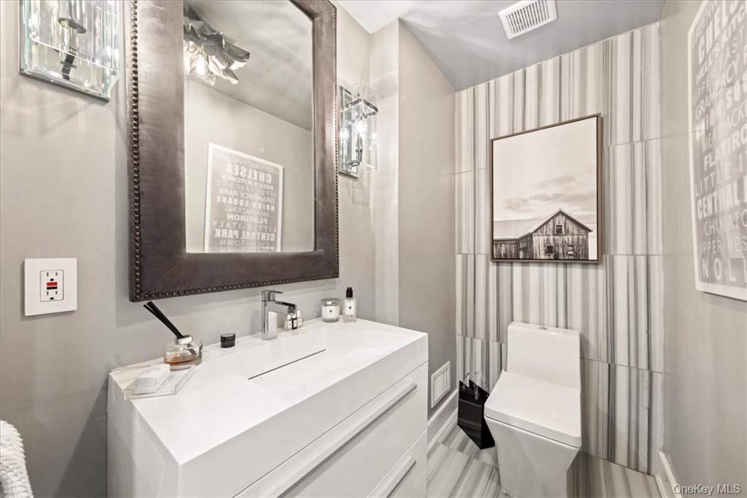 1570 Journeys End Road Croton-on-Hudson, NY 10520 - Photo 19 of 50 a bathroom with a sink and a mirror