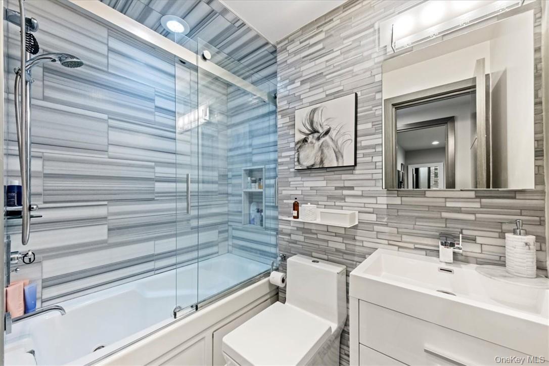 1570 Journeys End Road Croton-on-Hudson, NY 10520 - Photo 20 of 50 a bathroom with a sink and a mirror