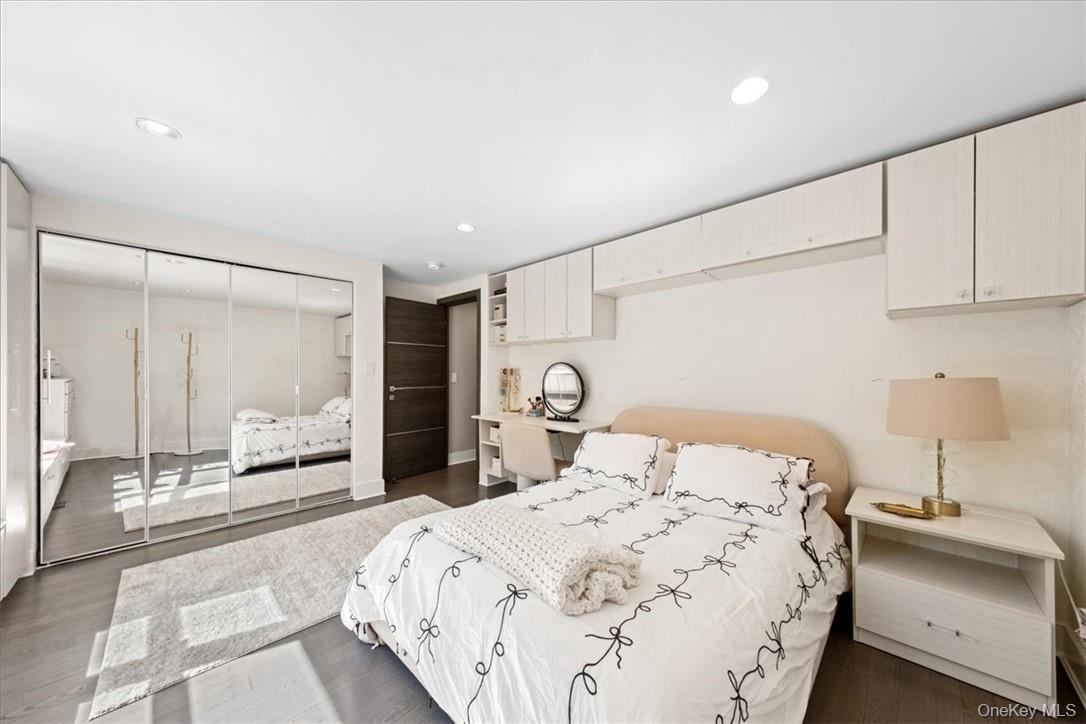 1570 Journeys End Road Croton-on-Hudson, NY 10520 - Photo 26 of 50 a bedroom with a double bed and a large mirror