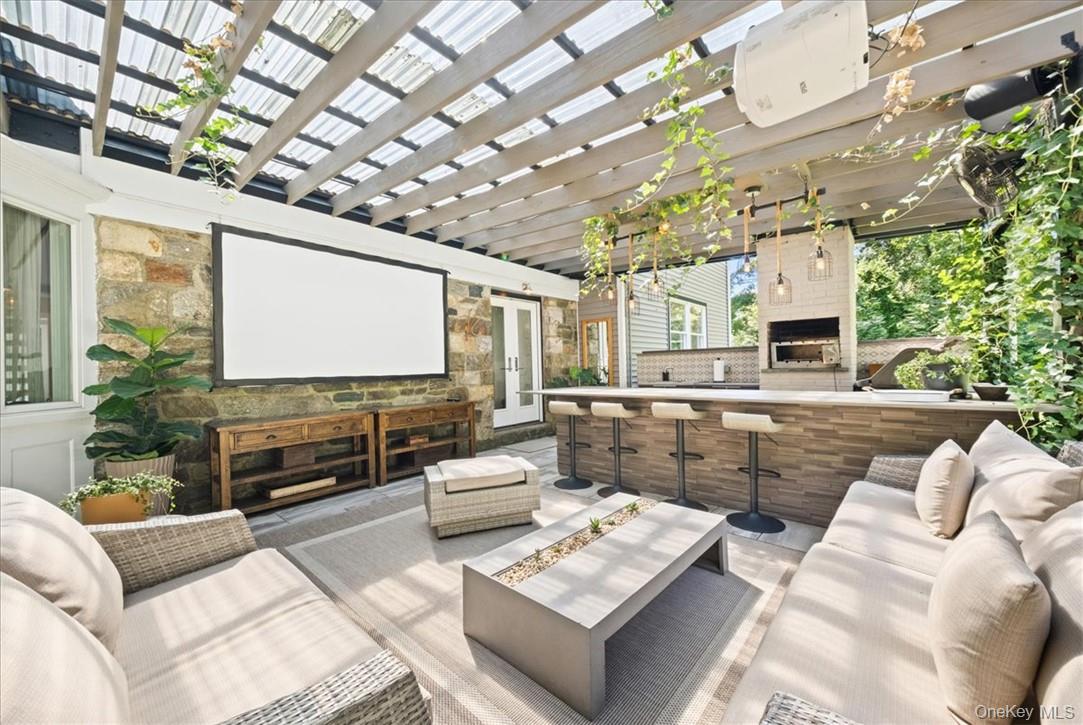 1570 Journeys End Road Croton-on-Hudson, NY 10520 - Photo 33 of 50 a living room with furniture and a flat screen tv