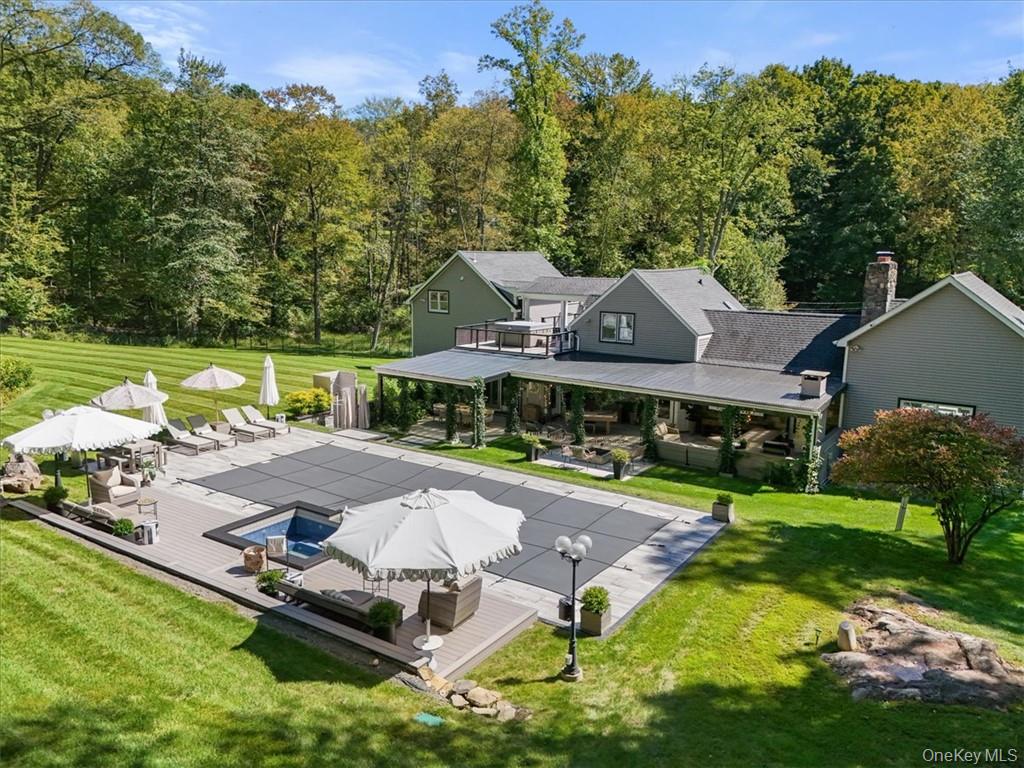 1570 Journeys End Road Croton-on-Hudson, NY 10520 - Photo 38 of 50 an aerial view of a house with swimming pool garden and patio