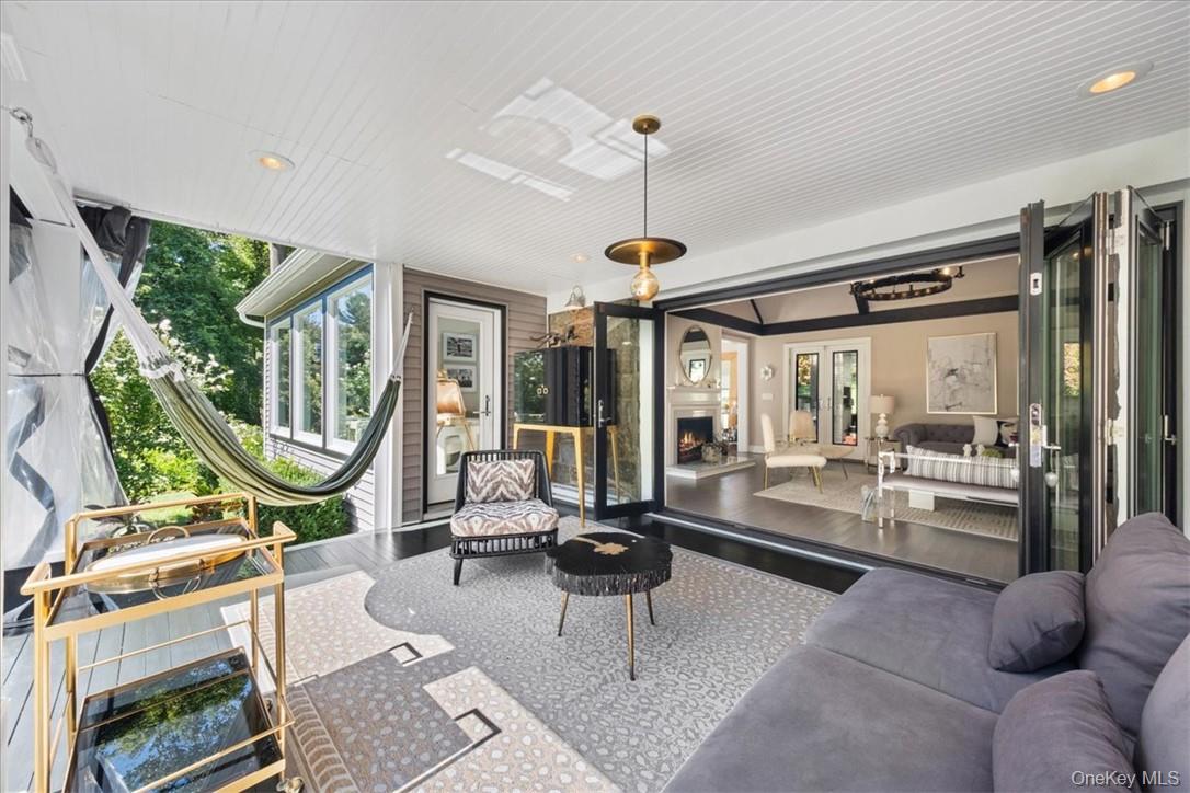 1570 Journeys End Road Croton-on-Hudson, NY 10520 - Photo 4 of 50 a living room with furniture a large window and stainless steel appliances