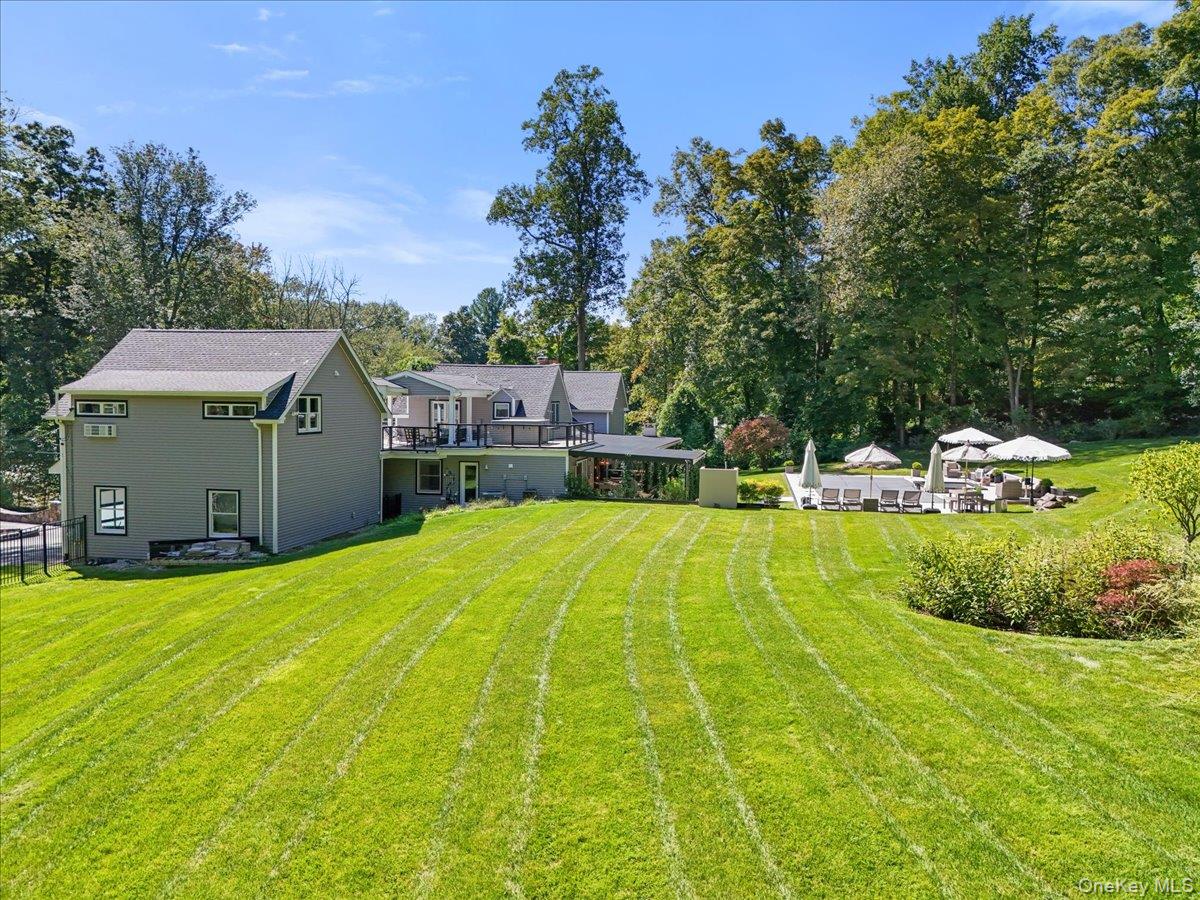 1570 Journeys End Road Croton-on-Hudson, NY 10520 - Photo 47 of 50 a view of a house with pool and a yard