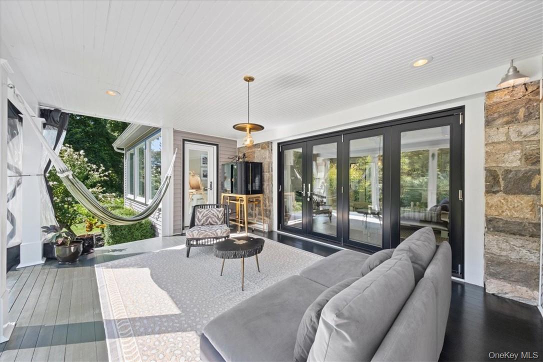 1570 Journeys End Road Croton-on-Hudson, NY 10520 - Photo 5 of 50 a living room with furniture and a floor to ceiling window